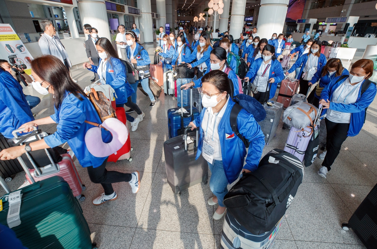 Filipino domestic workers arrive at Incheon Airport in August 2024 ahead of their participation in South Korea’s pilot foreign caregiver program starting in September. (Joint Press Corps)