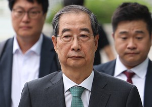 Ex-PM Han booked for alleged perjury over martial law attempt